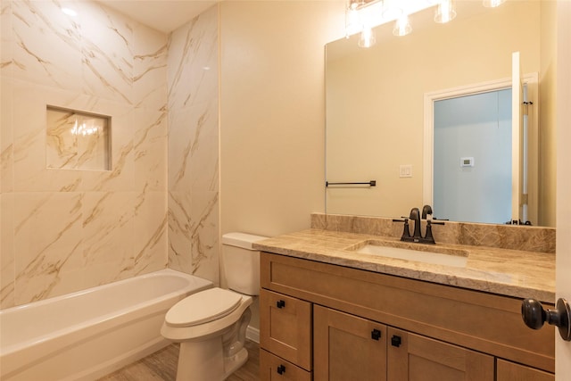 full bathroom with vanity, shower / tub combination, and toilet