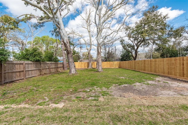 view of yard featuring a fenced backyard