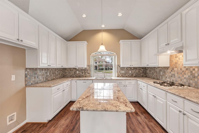 kitchen featuring a kitchen island, dark wood-style floors, white cabinets, white appliances, and a sink