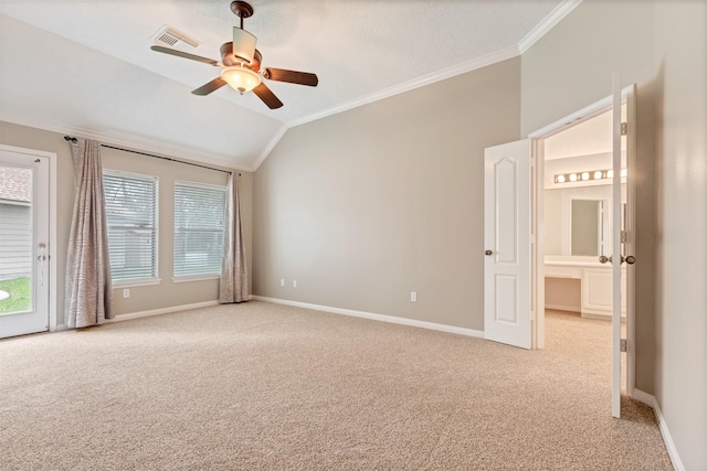 spare room with crown molding, a ceiling fan, baseboards, and light carpet