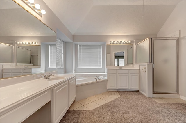 bathroom with tile patterned flooring, a shower stall, lofted ceiling, and a sink