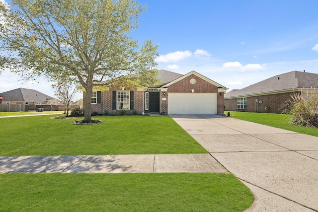 view of front of home featuring a front lawn, driveway, fence, a garage, and brick siding