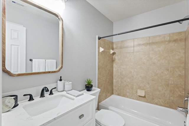 bathroom featuring visible vents, toilet, a textured ceiling, tub / shower combination, and vanity