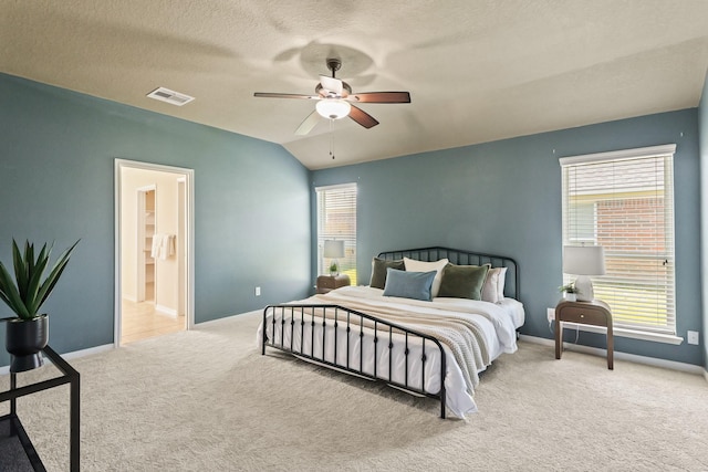 bedroom featuring visible vents, ceiling fan, baseboards, carpet, and vaulted ceiling