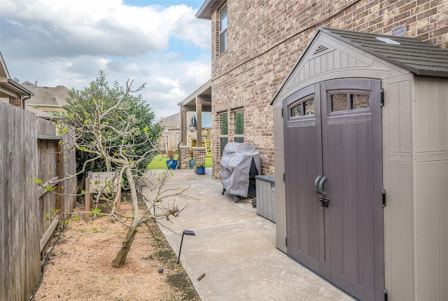 view of shed featuring a fenced backyard