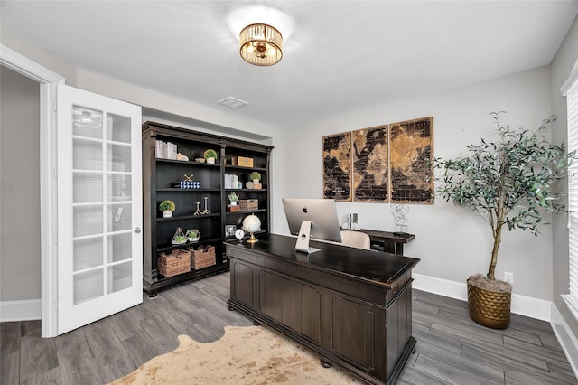 office area featuring visible vents, baseboards, and wood tiled floor