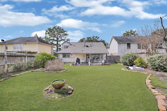 view of yard featuring a patio and a fenced backyard