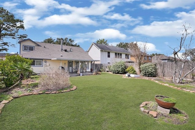 view of yard featuring a patio and a fenced backyard