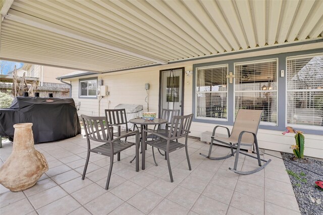 view of patio with area for grilling and outdoor dining space