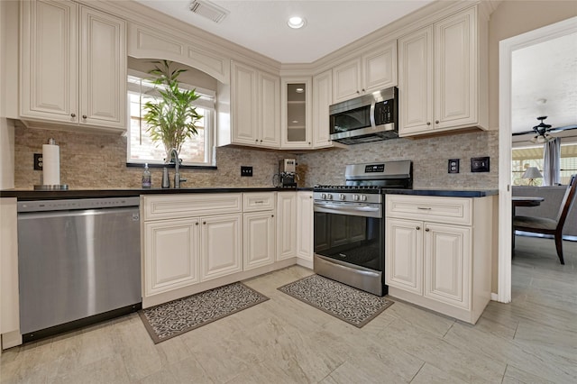 kitchen with visible vents, plenty of natural light, stainless steel appliances, and a sink