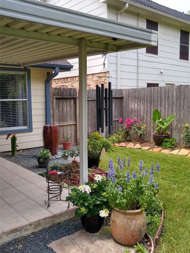 view of patio featuring fence