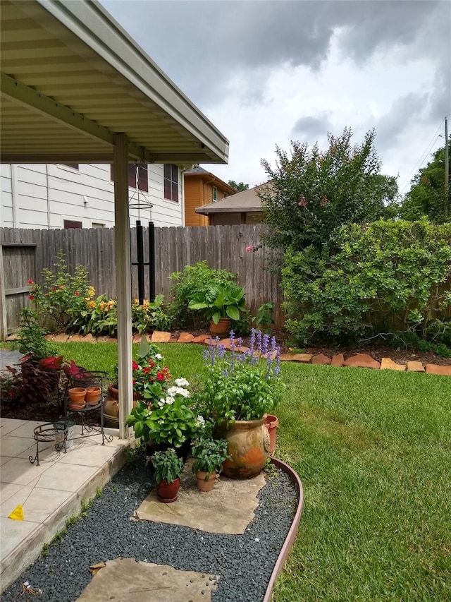 view of yard featuring a patio and fence