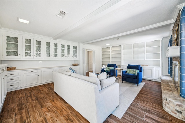 living room with visible vents, beam ceiling, a textured ceiling, dark wood-style floors, and crown molding