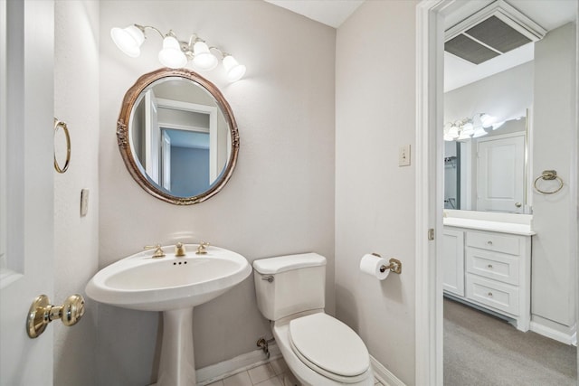 bathroom featuring baseboards and toilet