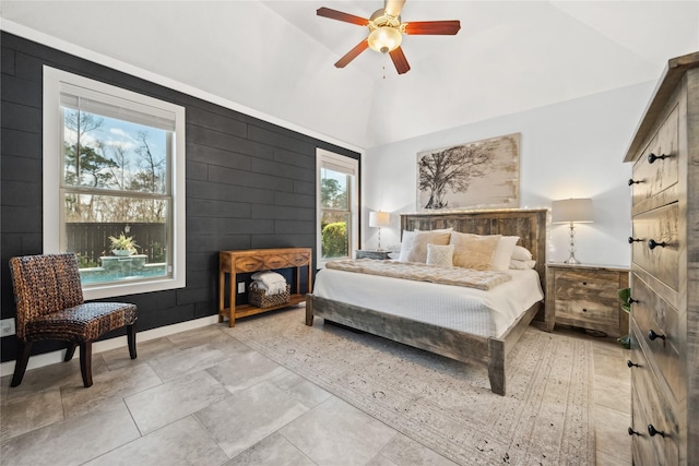 bedroom with baseboards, high vaulted ceiling, and a ceiling fan