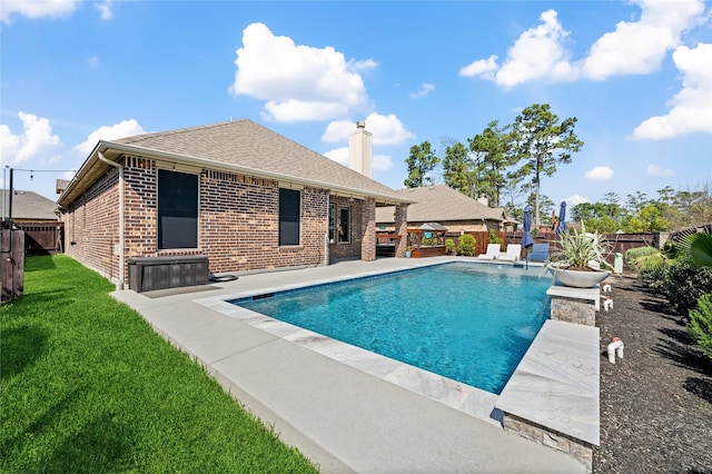 view of pool with a patio area, a lawn, a fenced in pool, and a fenced backyard