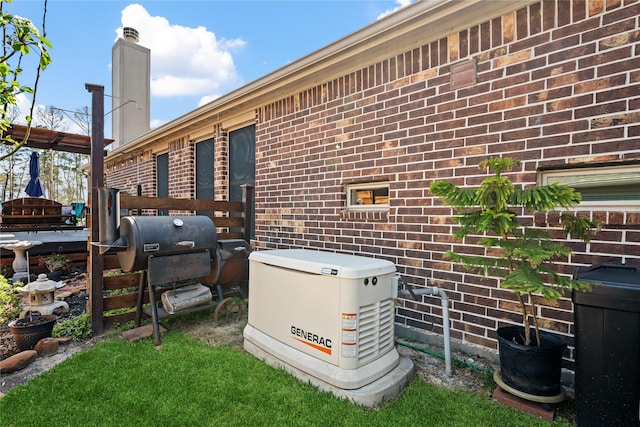 details with brick siding and a power unit