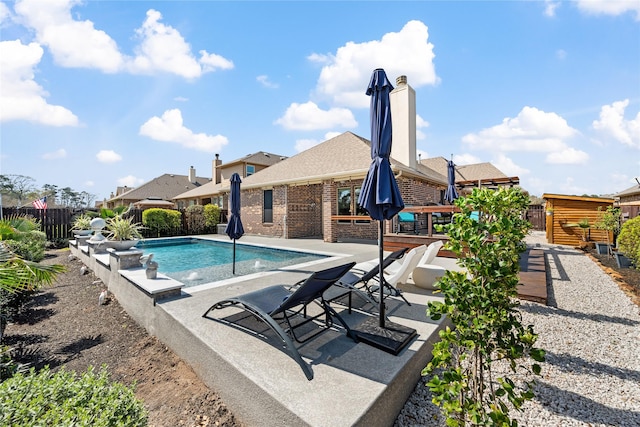 view of pool with a patio area, a fenced in pool, and a fenced backyard