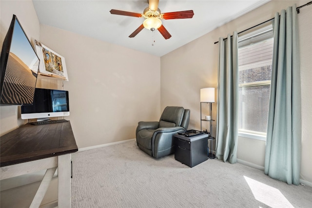 interior space featuring carpet flooring, baseboards, and ceiling fan