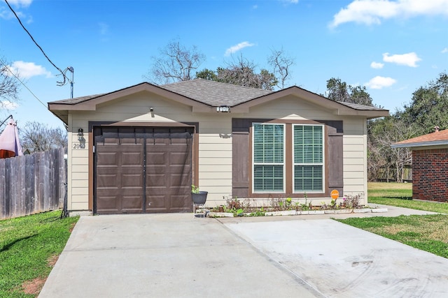 2000 Rosalee St, La Marque, TX 77568 - view of front of house featuring concrete driveway, an attached garage, and a shingled roof