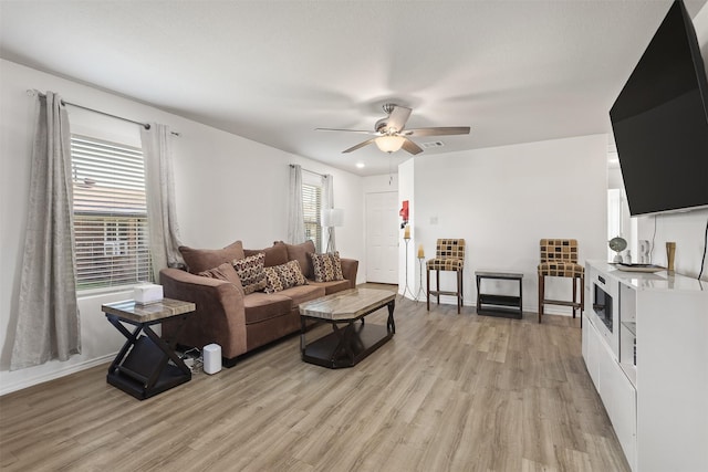 2000 Rosalee St, La Marque, TX 77568 - living area with light wood-style flooring, ceiling fan, and baseboards