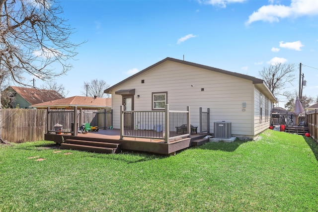 2000 Rosalee St, La Marque, TX 77568 - rear view of property with central AC and a wooden deck