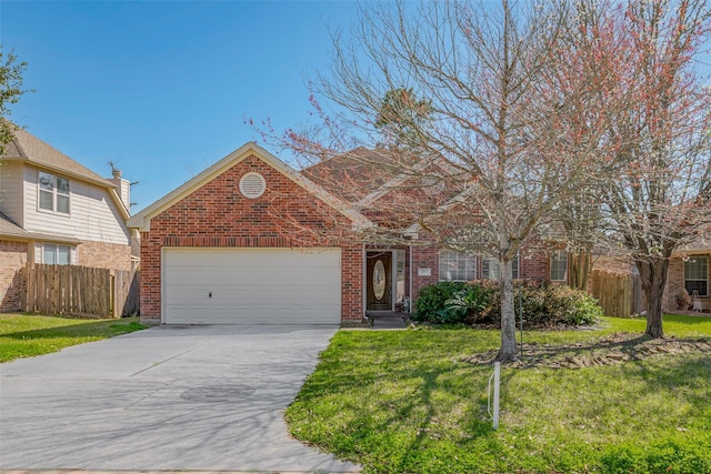 view of front of house with driveway, brick siding, an attached garage, and fence