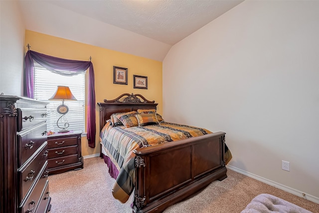 bedroom featuring baseboards, carpet, and vaulted ceiling