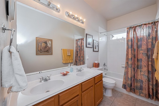 bathroom with tile patterned floors, toilet, shower / bath combo with shower curtain, and a sink