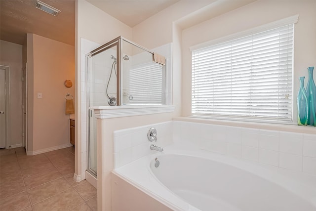 full bathroom with tile patterned flooring, visible vents, a shower stall, and a bath