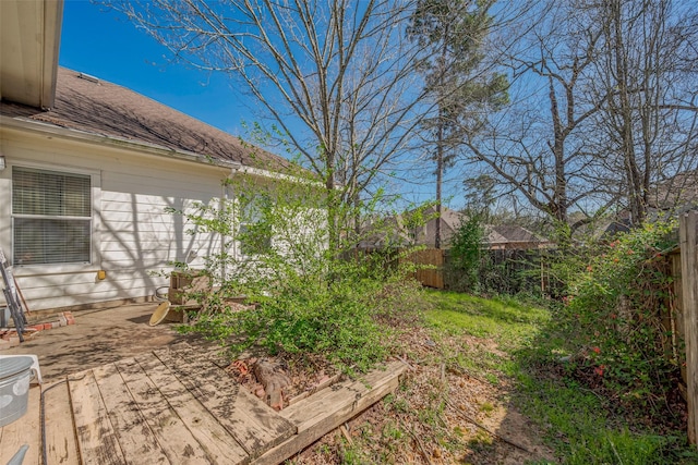 view of yard with a fenced backyard and a wooden deck