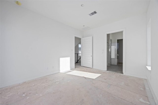 unfurnished bedroom with baseboards and visible vents