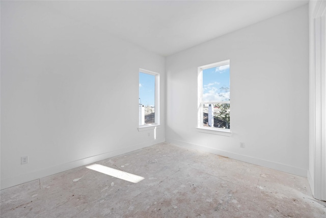 spare room featuring baseboards