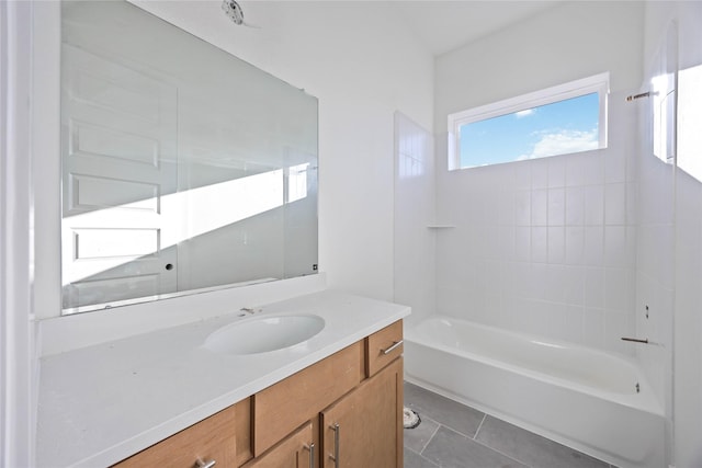 full bath with tile patterned floors, vanity, and shower / tub combination