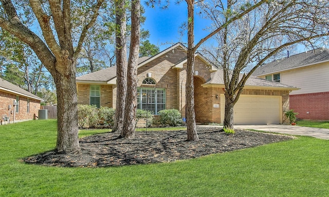 view of front facade featuring brick siding, a garage, concrete driveway, and a front lawn