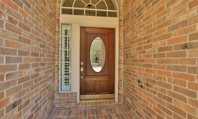 entrance to property with brick siding