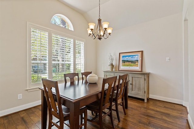 dining room featuring dark wood finished floors, a notable chandelier, lofted ceiling, and baseboards