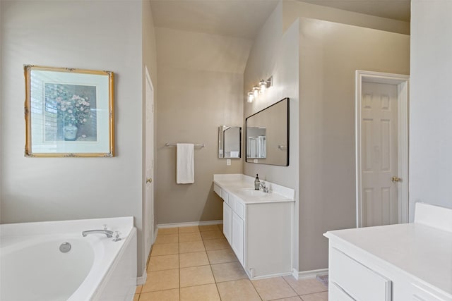 full bath with tile patterned floors, baseboards, vanity, and a garden tub