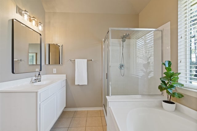 full bath featuring baseboards, a garden tub, a stall shower, tile patterned floors, and vanity