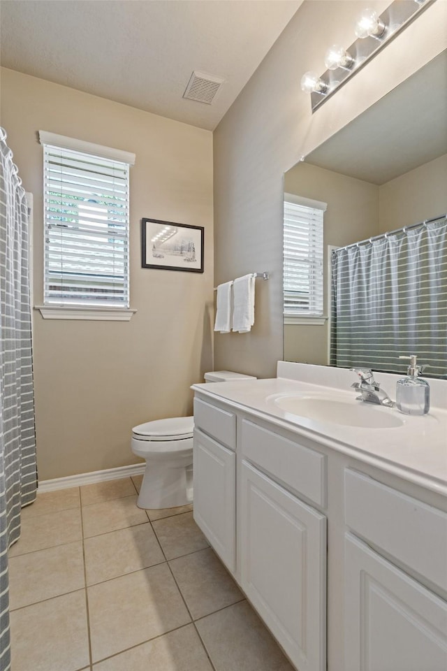 full bathroom featuring visible vents, baseboards, toilet, tile patterned floors, and vanity