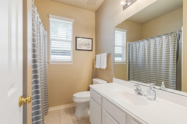 bathroom with tile patterned flooring, visible vents, toilet, and a wealth of natural light