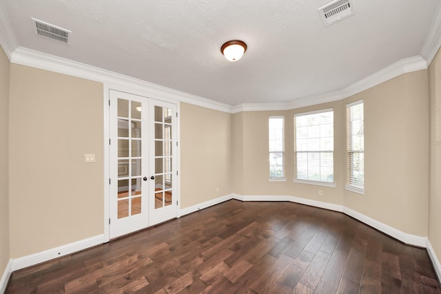 unfurnished room with french doors, visible vents, wood-type flooring, and ornamental molding