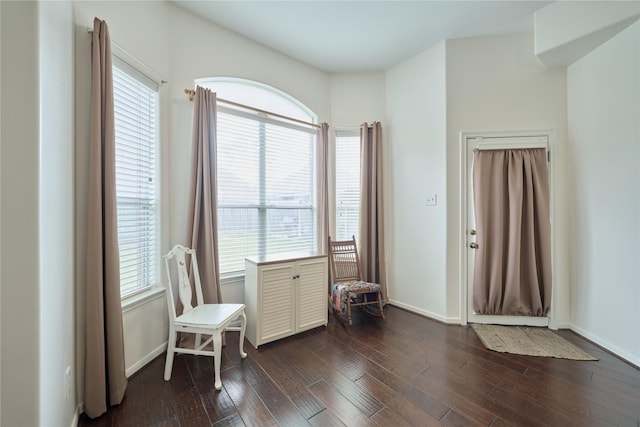 sitting room featuring dark wood-style floors and baseboards