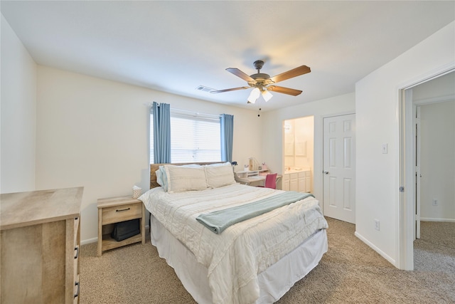 bedroom featuring visible vents, light carpet, ensuite bath, baseboards, and ceiling fan