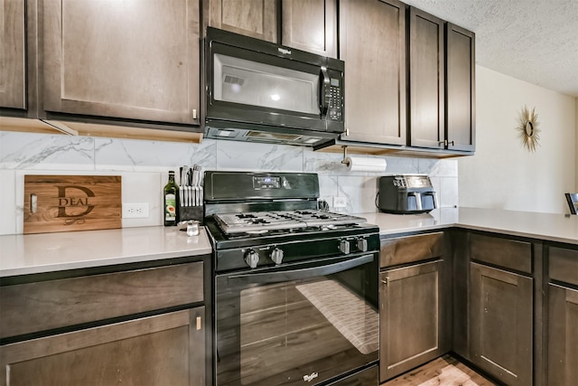 kitchen with black appliances, a textured ceiling, dark brown cabinetry, light countertops, and decorative backsplash