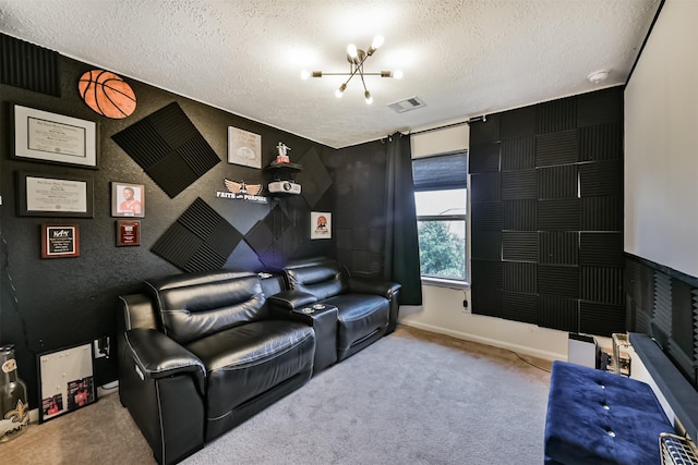 carpeted cinema with visible vents, a textured ceiling, and baseboards