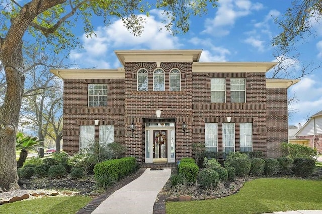 view of front facade featuring brick siding