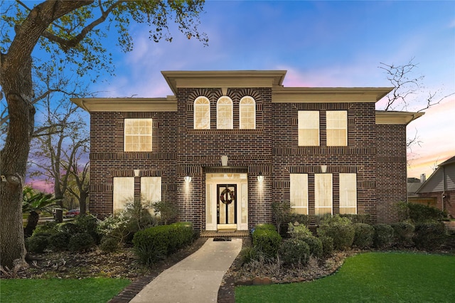 view of front facade featuring brick siding