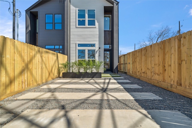 back of property with fence