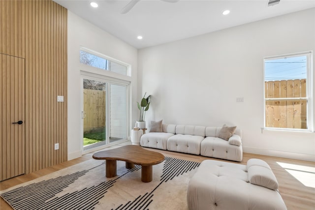 living room with recessed lighting, baseboards, wood finished floors, and ceiling fan